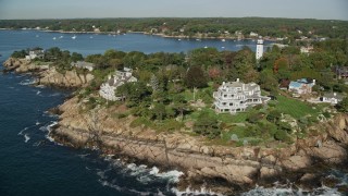 6K aerial stock footage orbiting away from oceanfront mansions among fall foliage, Manchester-by-the-Sea, Massachusetts Aerial Stock Footage | AX147_063