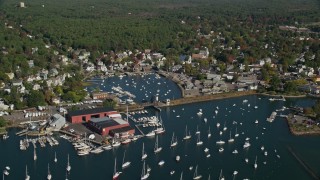 AX147_066E - 6K aerial stock footage flying over harbor with boats in autumn, Manchester-by-the-Sea, Massachusetts