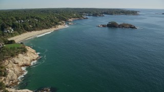 AX147_074E - 6K aerial stock footage flying by oceanfront homes to Graves Island, Manchester-by-the-Sea, Massachusetts