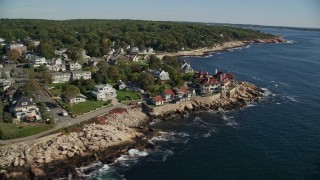 6K aerial stock footage flying by oceanfront homes, mansion, Gloucester, Massachusetts Aerial Stock Footage | AX147_079E