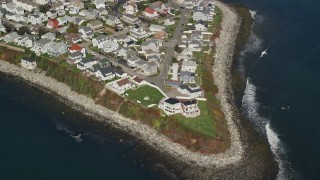 AX147_156 - 6K aerial stock footage flying over a coastal neighborhood, Hampton, New Hampshire