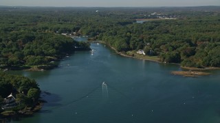 6K aerial stock footage flying over a creek situated among trees, Rye, New Hampshire Aerial Stock Footage | AX147_172