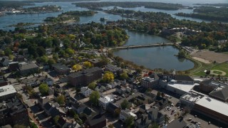 6K aerial stock footage of a coastal town with a bridge and fall foliage, Portsmouth, New Hampshire Aerial Stock Footage | AX147_178