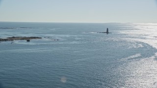 6K aerial stock footage approaching a lighthouse in the middle of the water, Kittery, Maine Aerial Stock Footage | AX147_193