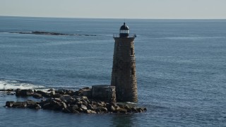 6K aerial stock footage approaching a lighthouse in the middle of the water, Kittery, Maine Aerial Stock Footage | AX147_194E