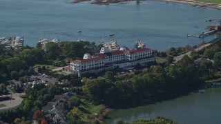 6K aerial stock footage orbiting Wentworth by the Sea hotel in autumn, New Castle, New Hampshire Aerial Stock Footage | AX147_200