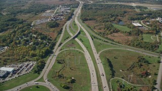 AX147_206 - 6K aerial stock footage flying over Portsmouth Traffic Circle, interchanges, autumn, Portsmouth, New Hampshire