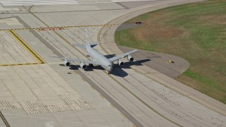 6K aerial stock footage of a military plane taxiing, autumn, Portsmouth International Airport, New Hampshire Aerial Stock Footage | AX147_216E