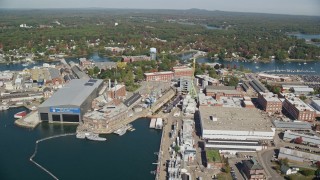 AX147_223E - 6K aerial stock footage approaching Portsmouth Naval Shipyard, autumn, Kittery, Maine