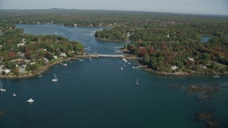 6K aerial stock footage flying by small bridge, waterfront communities, autumn, Kittery, Maine Aerial Stock Footage | AX147_225