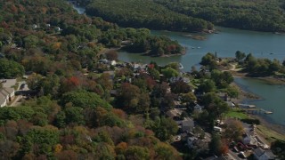 6K aerial stock footage flying by waterfronts homes, colorful autumn trees, Kittery, Maine Aerial Stock Footage | AX147_227