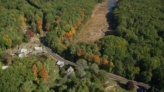 6K aerial stock footage of a bird's eye view of colorful forest, rural homes, revealing a river, Kittery, Maine Aerial Stock Footage | AX147_228E