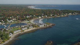 6K aerial stock footage approaching small coastal town, York Harbor, beach, autumn, York, Maine Aerial Stock Footage | AX147_232