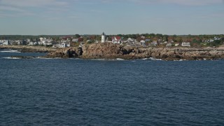 6K aerial stock footage flying low, approaching Cape Neddick Light, autumn, York, Maine Aerial Stock Footage | AX147_240