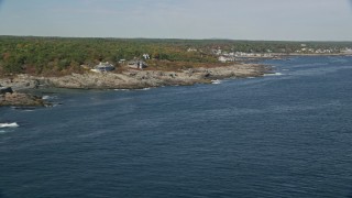 6K aerial stock footage flying by oceanfront homes, colorful trees in autumn, Ogunquit, Maine Aerial Stock Footage | AX147_248