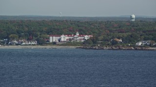 6K aerial stock footage flying by The Colony Hotel, colorful trees, autumn, Kennebunkport, Maine Aerial Stock Footage | AX147_254