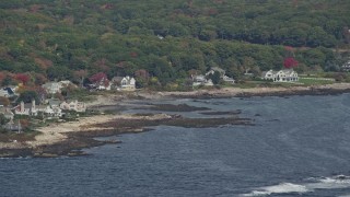 6K aerial stock footage flying by oceanfront mansions, rocky coastline, autumn, Kennebunkport, Maine Aerial Stock Footage | AX147_257E