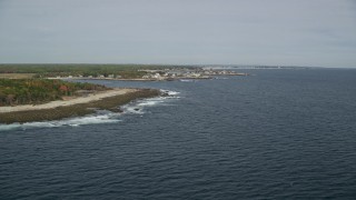 6K aerial stock footage flying by the coastline, approaching coastal town, Biddeford, Maine Aerial Stock Footage | AX147_263E