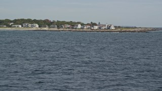 6K aerial stock footage flying low over water, approaching oceanfront homes, autumn, Biddeford, Maine Aerial Stock Footage | AX147_266