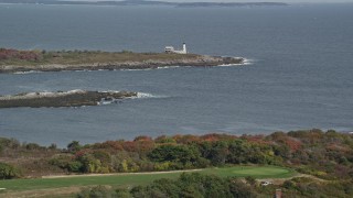 AX147_269 - 6K aerial stock footage approaching Wood Island Light, autumn, Biddeford, Maine