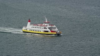 6K aerial stock footage tracking a ferry carrying passengers and vehicles, Portland, Maine Aerial Stock Footage | AX147_320