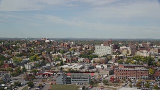 6K aerial stock footage flying by apartments, office buildings, autumn trees, Portland, Maine Aerial Stock Footage | AX147_324