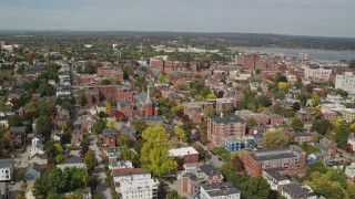 6K aerial stock footage orbiting apartments, Saint Dominics Roman Catholic Church, autumn, Portland, Maine Aerial Stock Footage | AX147_325E