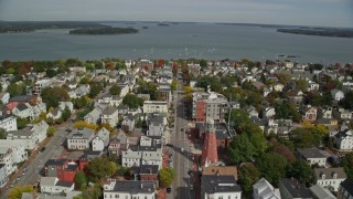 6K aerial stock footage flying over coastal neighborhood to Eastern Promenade, bay,  Portland, Maine Aerial Stock Footage | AX147_340E