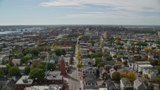 AX147_346E - 6K aerial stock footage approaching Eastern Promenade, coastal neighborhood, autumn, Portland, Maine