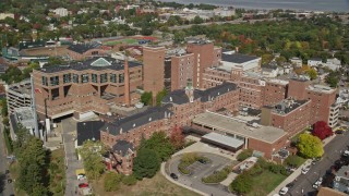 AX147_353E - 6K aerial stock footage orbiting Maine Medical Center, autumn, Portland, Maine