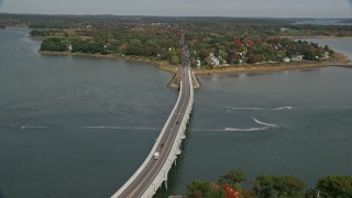 6K aerial stock footage flying by waterfront homes, office buildups, small bridge, Portland, Maine Aerial Stock Footage | AX147_361E