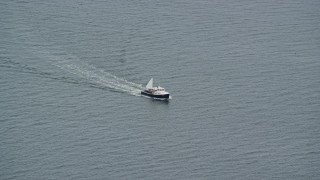 6K aerial stock footage tracking a fishing boat on the water, Chebeague Island, Maine Aerial Stock Footage | AX147_372