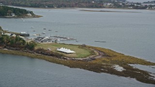 6K aerial stock footage flying by a pavilion on an island, revealing a marina, autumn, Harpswell, Maine Aerial Stock Footage | AX147_373E