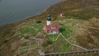 AX147_388E - 6K aerial stock footage approaching  Seguin Island, tilting up to reveal Seguin Light, Phippsburg, Maine