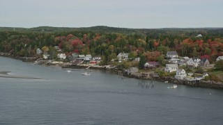 6K aerial stock footage flying over waterfront homes, colorful trees in autumn, Georgetown, Maine Aerial Stock Footage | AX147_398