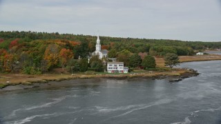 6K aerial stock footage of Phippsburg Congregational Church, waterfront home, autumn, Phippsburg, Maine Aerial Stock Footage | AX147_403E