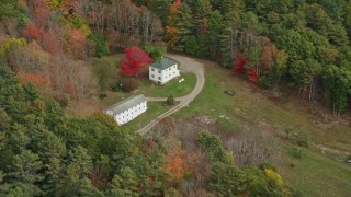 6K aerial stock footage flying by rural homes, tilt down, autumn, Woolwich, Maine Aerial Stock Footage | AX147_417