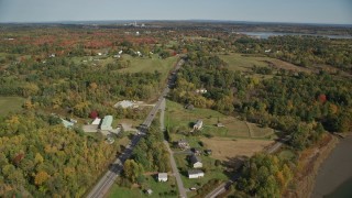 6K aerial stock footage of small bridges, Highway 1 over river, and rural homes, autumn, Thomaston, Maine Aerial Stock Footage | AX148_067E