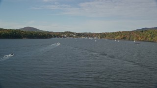 6K aerial stock footage flying low over Rockport Harbor, approach small coastal town, autumn, Rockport, Maine Aerial Stock Footage | AX148_093