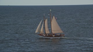 6K aerial stock footage tracking a sailboat, West Penobscot Bay, autumn, Rockport, Maine Aerial Stock Footage | AX148_104E