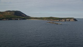 AX148_179 - 5.5K aerial stock footage flying by beach, Newport Cove, autumn, Bar Harbor, Mount Desert Island, Maine