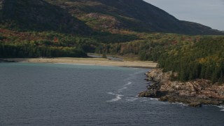 AX148_180 - 5.5K aerial stock footage flying by Newport Cove beach, autumn, Bar Harbor, Mount Desert Island, Maine