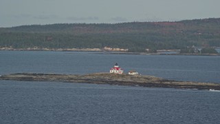 AX148_181E - 5.5K aerial stock footage flying by Egg Rock Light, Egg Rock, autumn, Bar Harbor, Maine