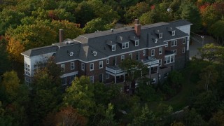 5.5K aerial stock footage approaching waterfront mansion atop a rocky coastline, autumn, Bar Harbor, Maine Aerial Stock Footage | AX148_186