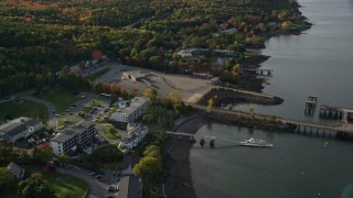 5.5K aerial stock footage tilting down on Atlantic Oceanside hotel near the harbor, autumn, Bar Harbor, Maine Aerial Stock Footage | AX148_223