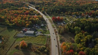 5.5K aerial stock footage of a bird's eye of road among forest with fall foliage, Bar Harbor, Maine Aerial Stock Footage | AX148_232E