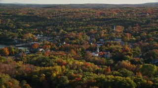 5.5K aerial stock footage flying by quaint coastal town among fall foliage, Blue Hill, Maine Aerial Stock Footage | AX149_017