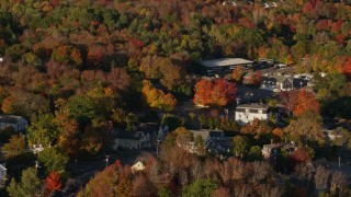 5.5K aerial stock footage passing houses in a small town, fall foliage, Blue Hill, Maine Aerial Stock Footage | AX149_030