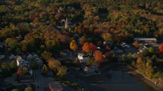 5.5K aerial stock footage passing by a small coastal town and fall foliage, Blue Hill, Maine Aerial Stock Footage | AX149_031E