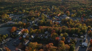 5.5K aerial stock footage flying over small coastal town homes and streets in autumn, Blue Hill, Maine Aerial Stock Footage | AX149_033